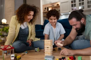 boy playing with his mother and father