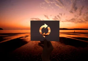 Signpost with multiple directions at sunset