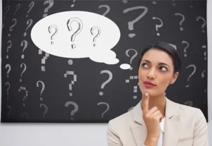 Signpost with multiple directions at sunset