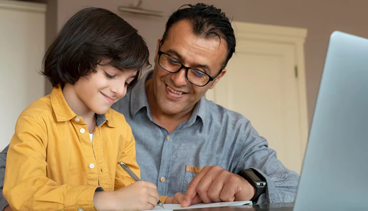 Father teaching son to read
