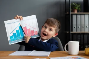 Excited child showing chart in classroom